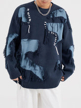 Pull à pompons patchwork